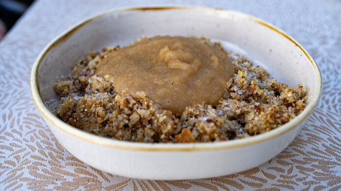 Semolina dish with apple sauce served in a beautiful white ceramic plate 