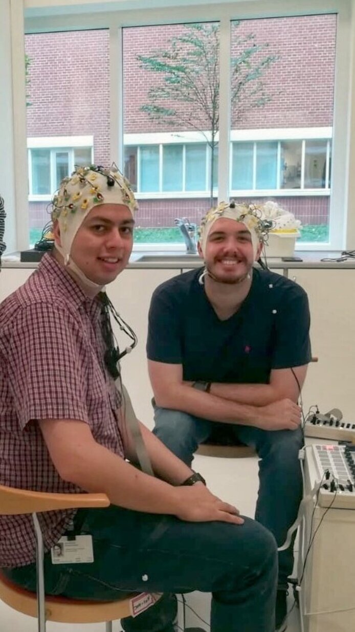 Demonstration of one of the EEG paradigms used at the Center for Music in the Brain. Jan Stupacher in the back with two colleagues.