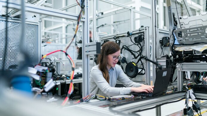 Young female engineer testing vehicles.