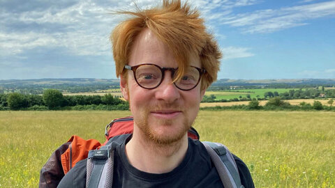 Portrait of a young researcher with red hair, short beard and glasses