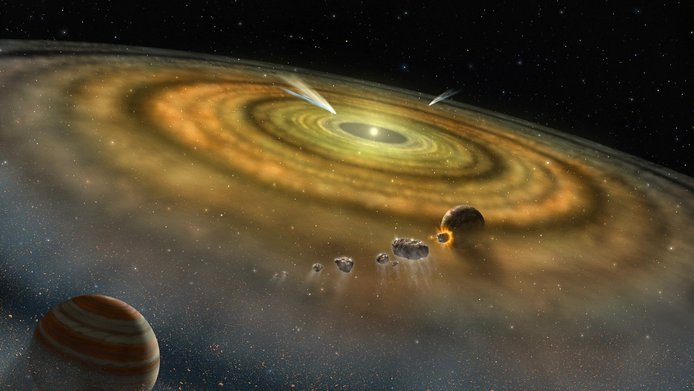 Künstlerische Darstellung der Entstehung von Planeten: in der Mitte ein Stern mit Kreisen von Staubpartikeln und Gas am äußeren Rand - dazwischen werden Planeten sichtbar