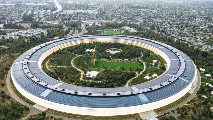 Aerial view of Silicon Valley in California, with a massive ring (Apple Park) in the foreground