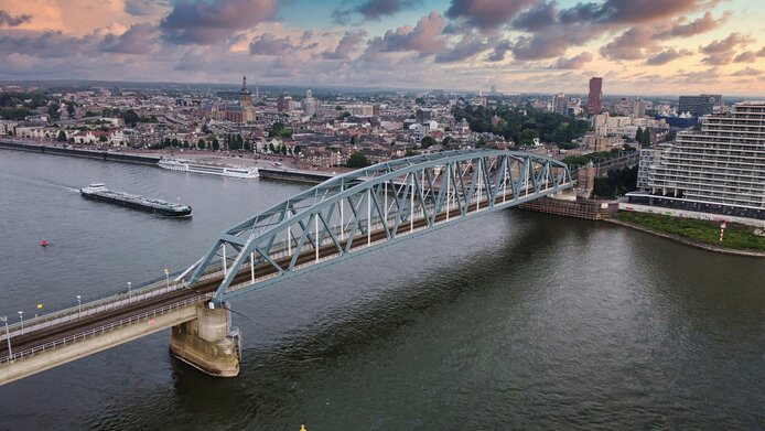 Cityscape with railway bridge and the Waal River in Nijmegen, Netherlands